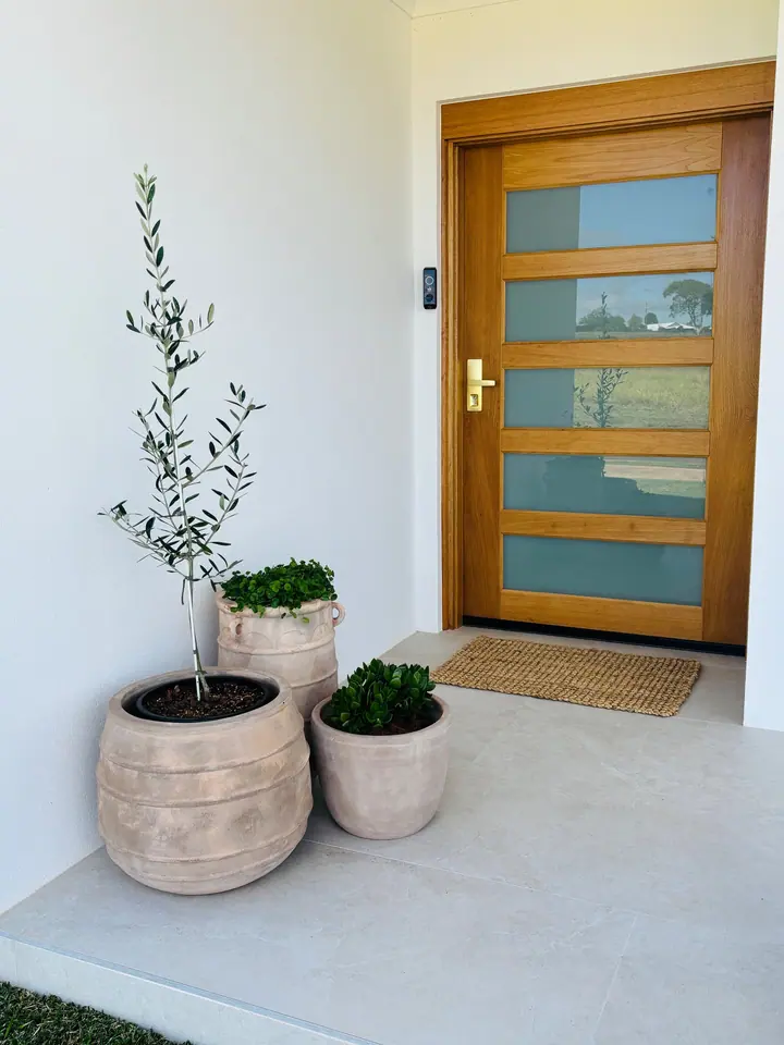 Front entry porch with large-format floor tiles