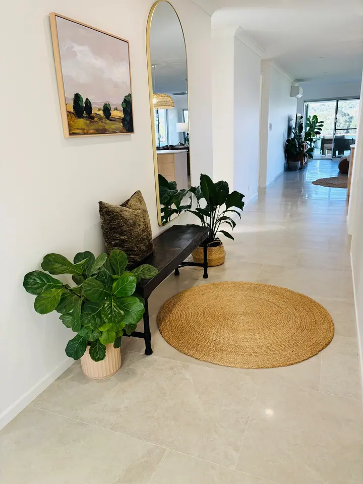 Hallway with large-format polished floor tiles